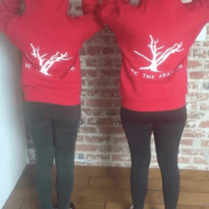 employees showing off red branch hoodies