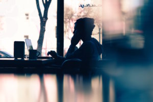 employee on computer practicing company culture