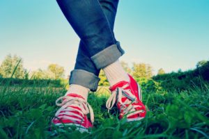 red converse green grass person field