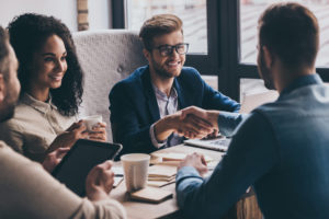 shaking hands after group interview