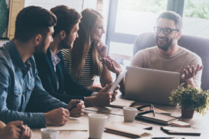 Coworkers meeting in conference room