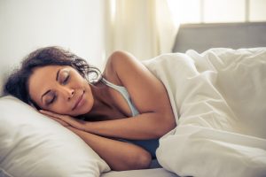 Woman sleeping soundly after using mindfulness performance management tech