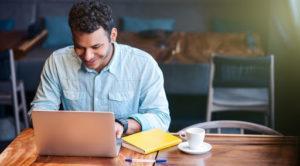 Man hiring salesperson over computer