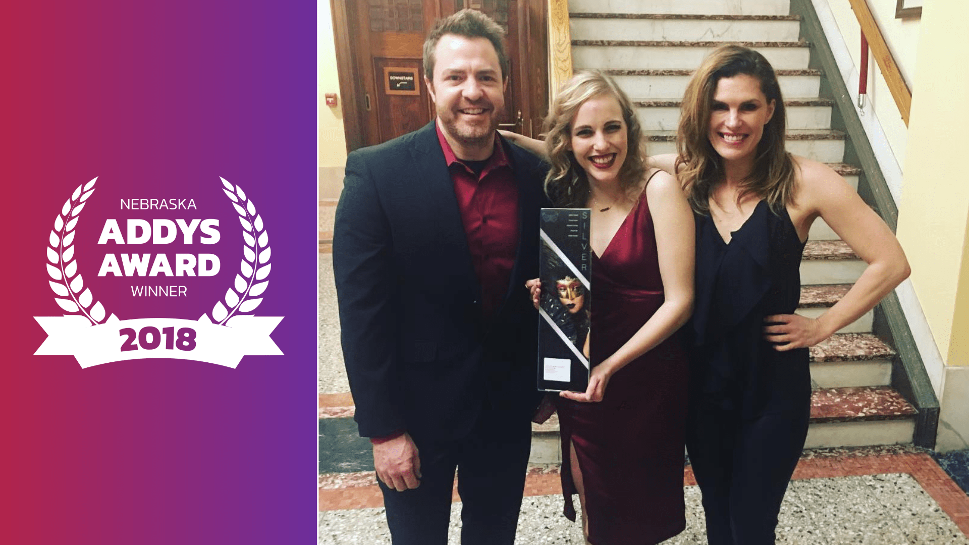 Jeremy Hogan, Kristine Osborne, and Maren Hogan pose with 2018 Addy Award for Best Promotional Video